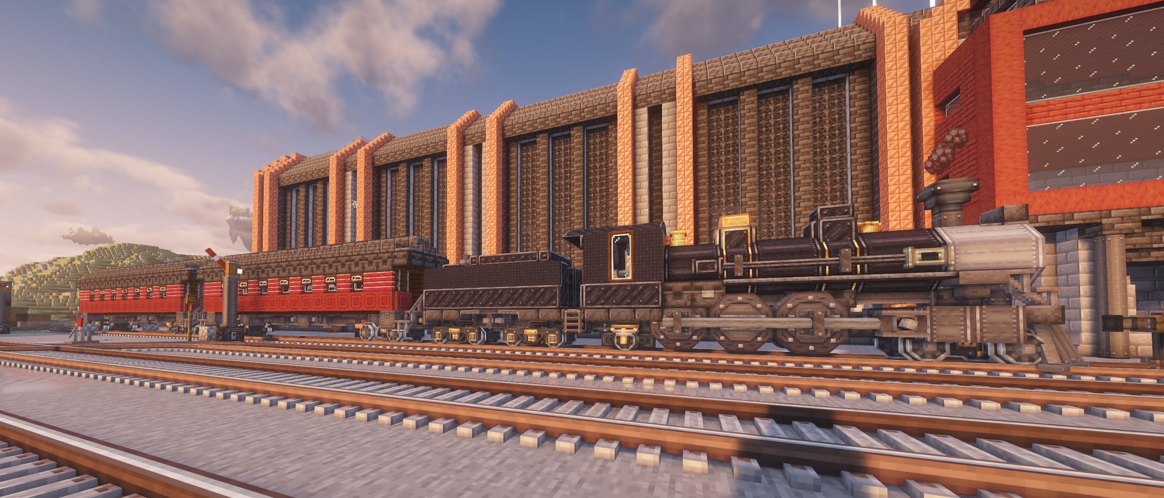 La Longue Veille, locomotive à vapeur sombre et ses voitures rouges, sur les voies devant un grand bâtiment de brique.